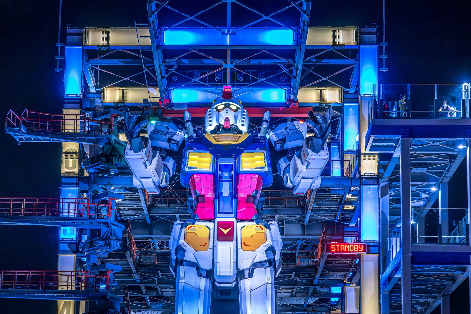 Humanoid robots lined up on an assembly line representing 2026–2027 production targets